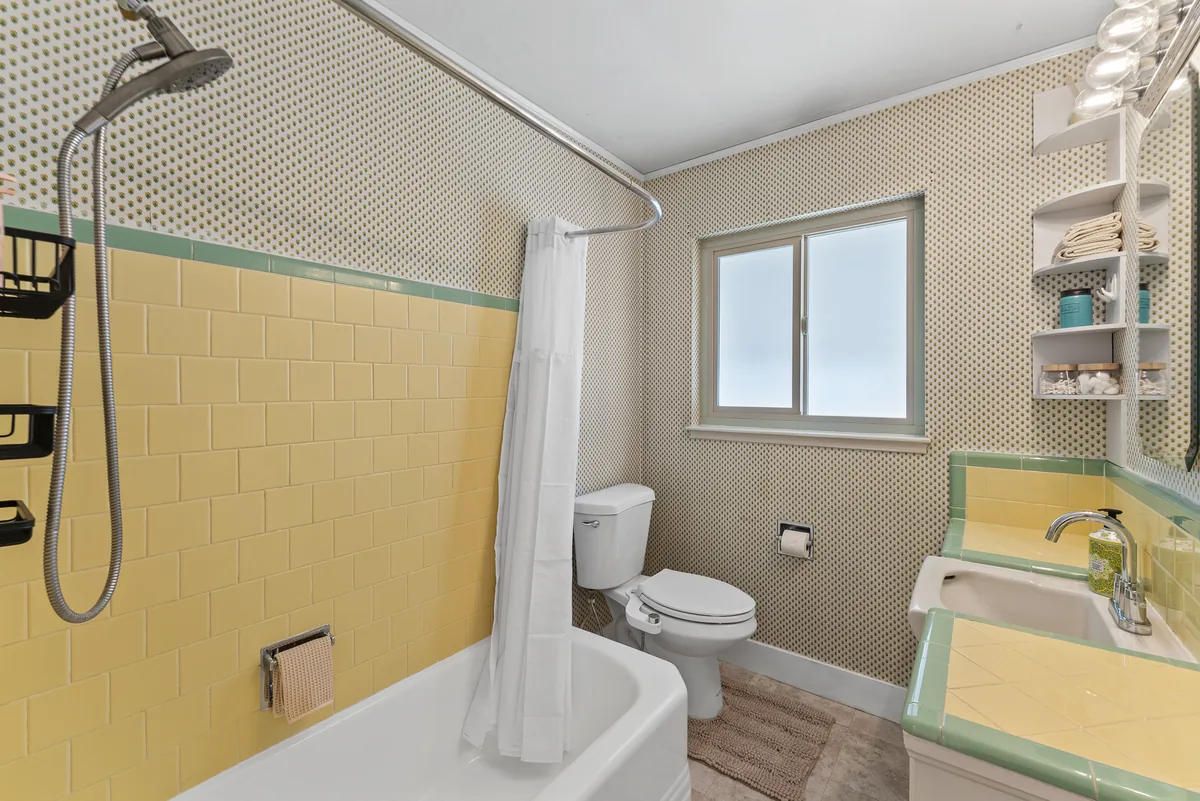 Glenmanor full bathroom with tub and shower