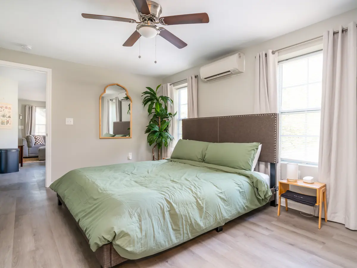 House St bedroom guest-ready: king bed, mini-split, styled decor