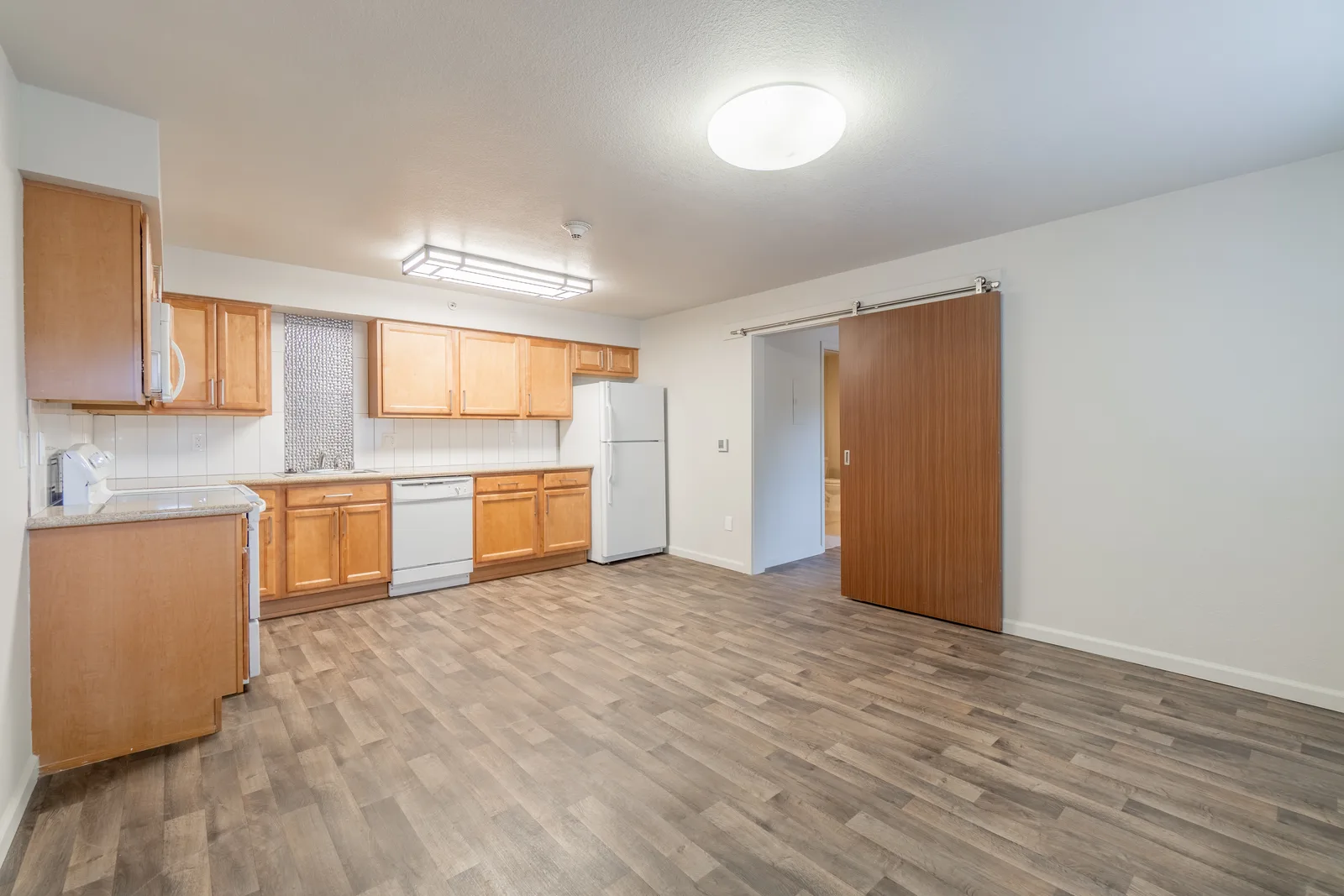 Midtown Manor Unit 1 before: empty room mid-renovation