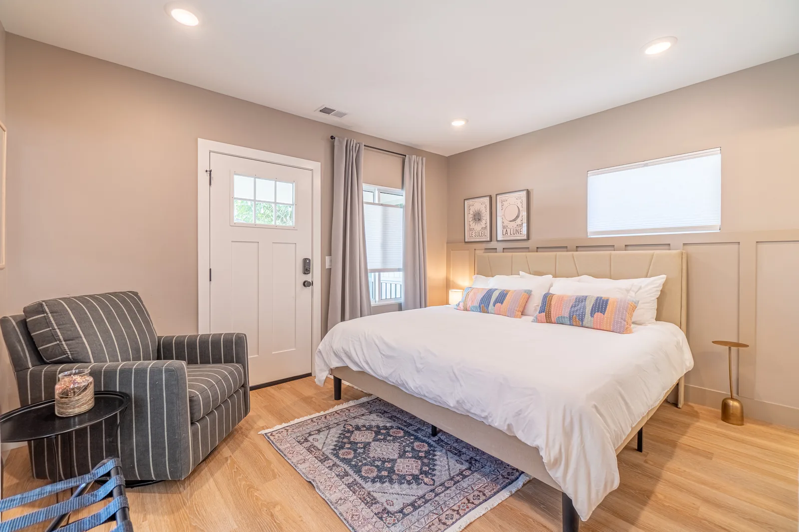 Vine St bedroom after: styled guest room with bed, linens and decor